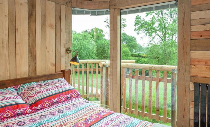 King size bed at Trawscwm Treehouse